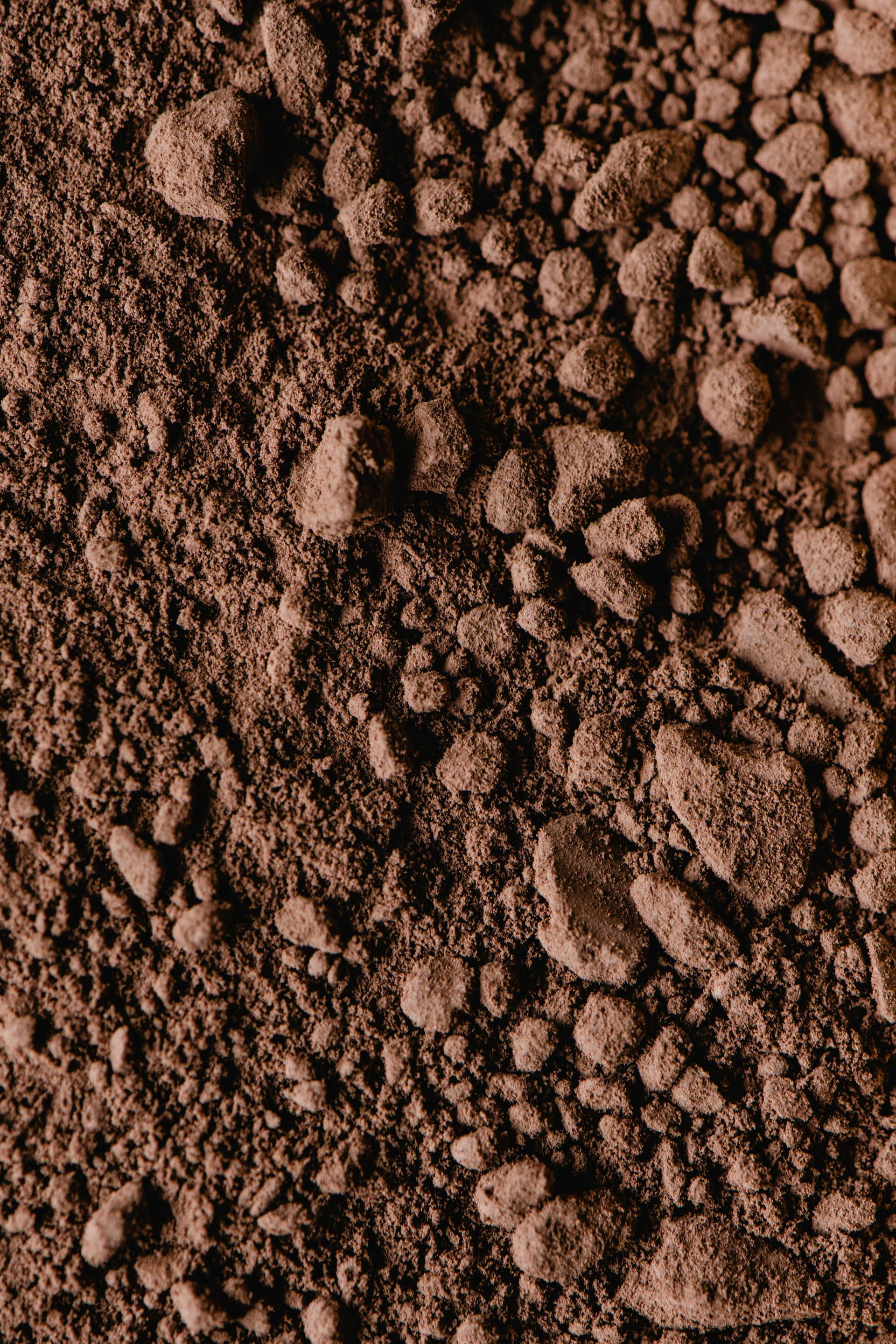 Close-up of brown, grainy substance with irregular, pebble-like chunks. — Laurieton Landscape Supplies In Kew, NSW