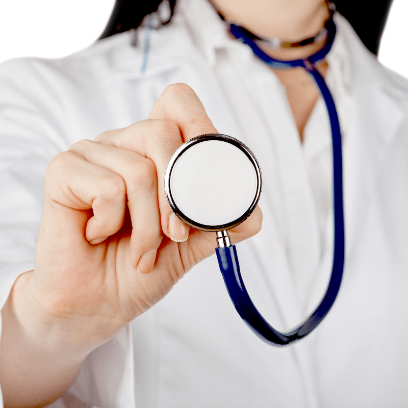 Doctor holding a stethoscope toward the camera in a white coat