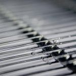 A close up of the inside of a refrigeration unit with frozen water droplets