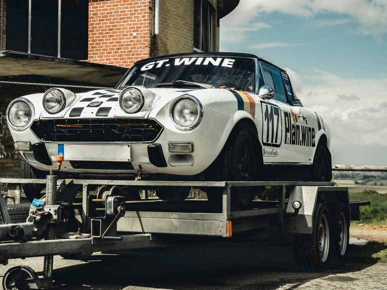White Rally Car — Best Price Towing in Wyee, NSW
