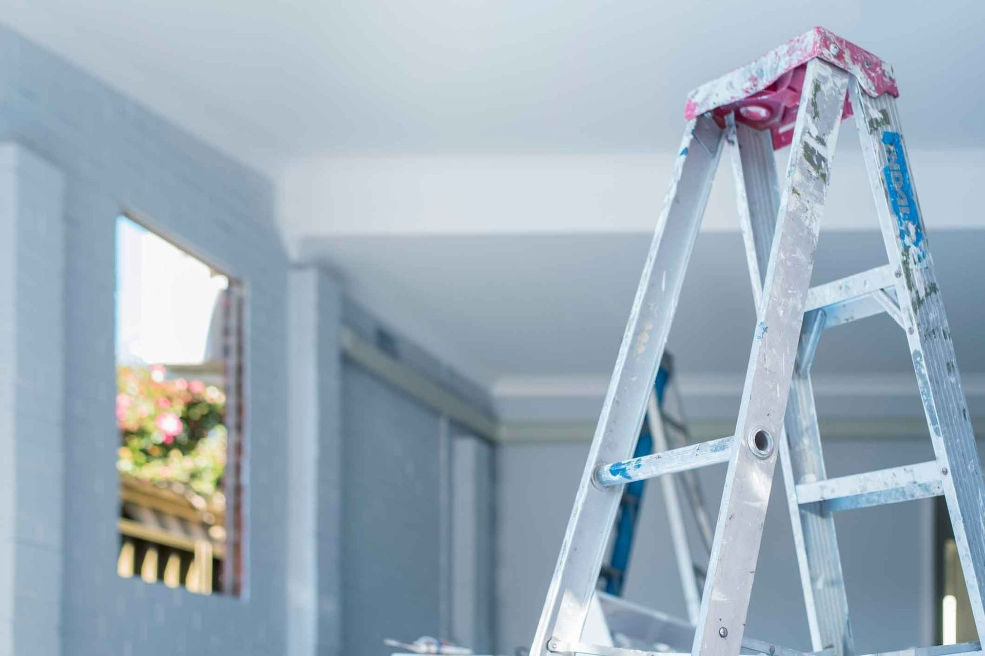 A Ladder Is Sitting In The Middle Of A Room — Auslinc Building Services In Wingham, NSW