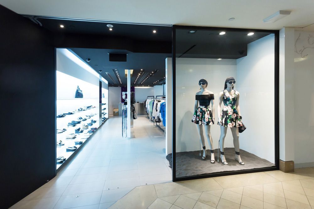 Two Mannequins Are Standing In Front Of A Store Window — L.A.F Electrical P/L In Empire Bay, NSW