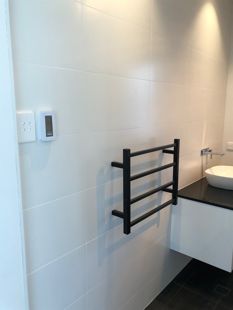 A Bathroom With A Sink And A Towel Rack On The Wall β L.A.F Electrical P/L In Empire Bay, NSW