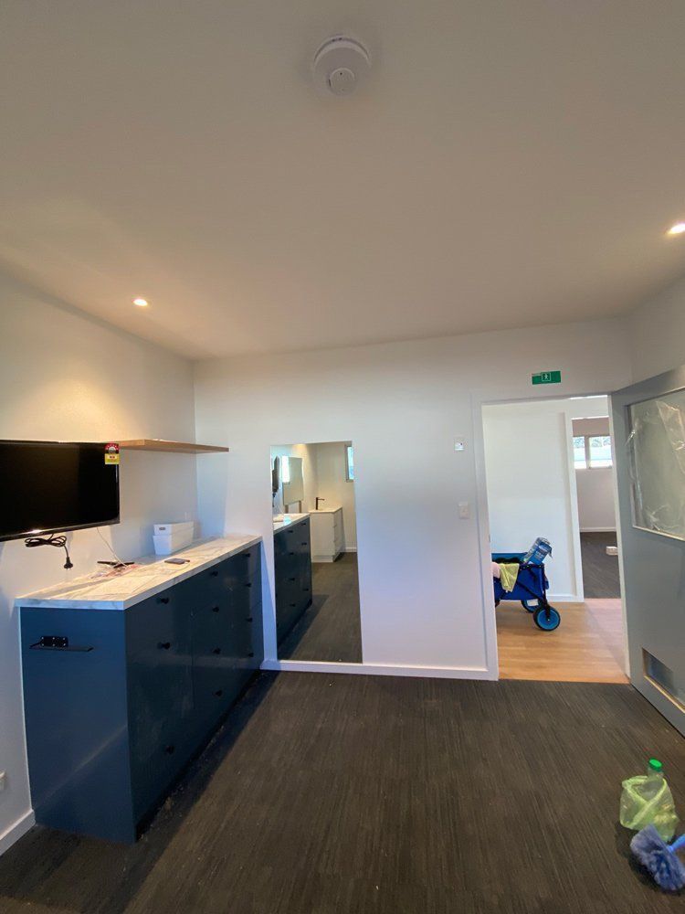 A Room With A Lot Of Cabinets And A Tv On The Wall — L.A.F Electrical P/L In Umina, NSW