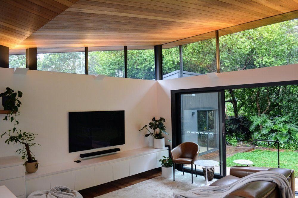 A Living Room With A Flat Screen Tv On The Wall — L.A.F Electrical P/L In Umina, NSW