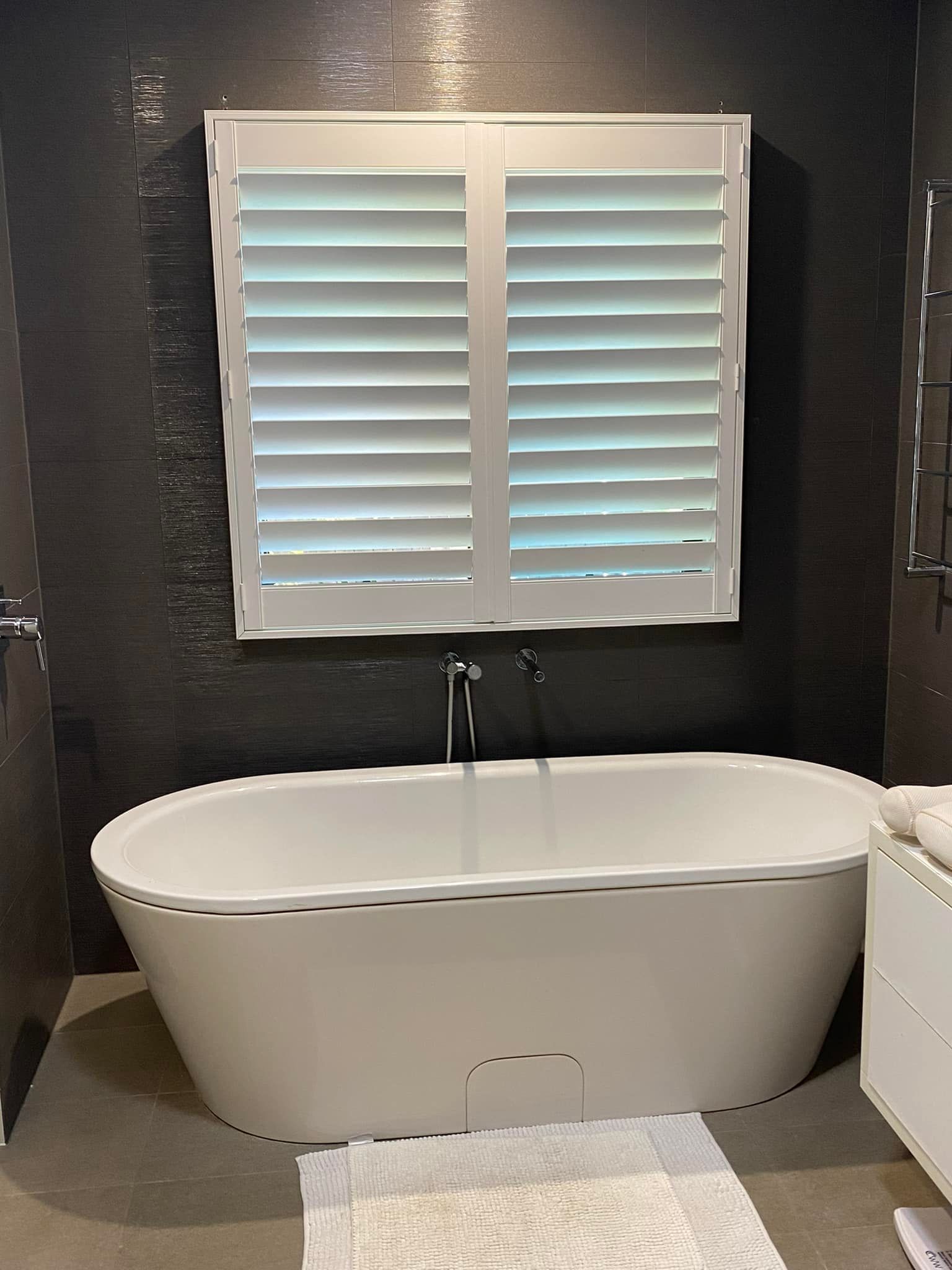 A Room With a Large Window With Shutters — Whitsunday Blinds & Security In Beaconsfield, QLD
