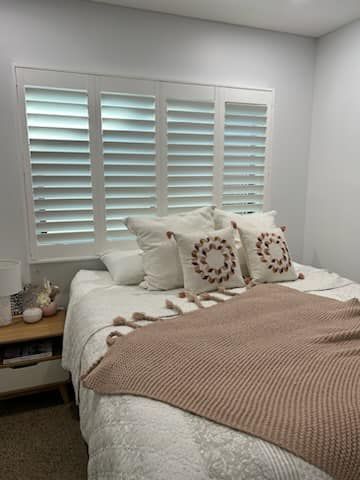 A Living Room With a Rocking Horse and Shutters on The Windows — Whitsunday Blinds & Security In Beaconsfield, QLD