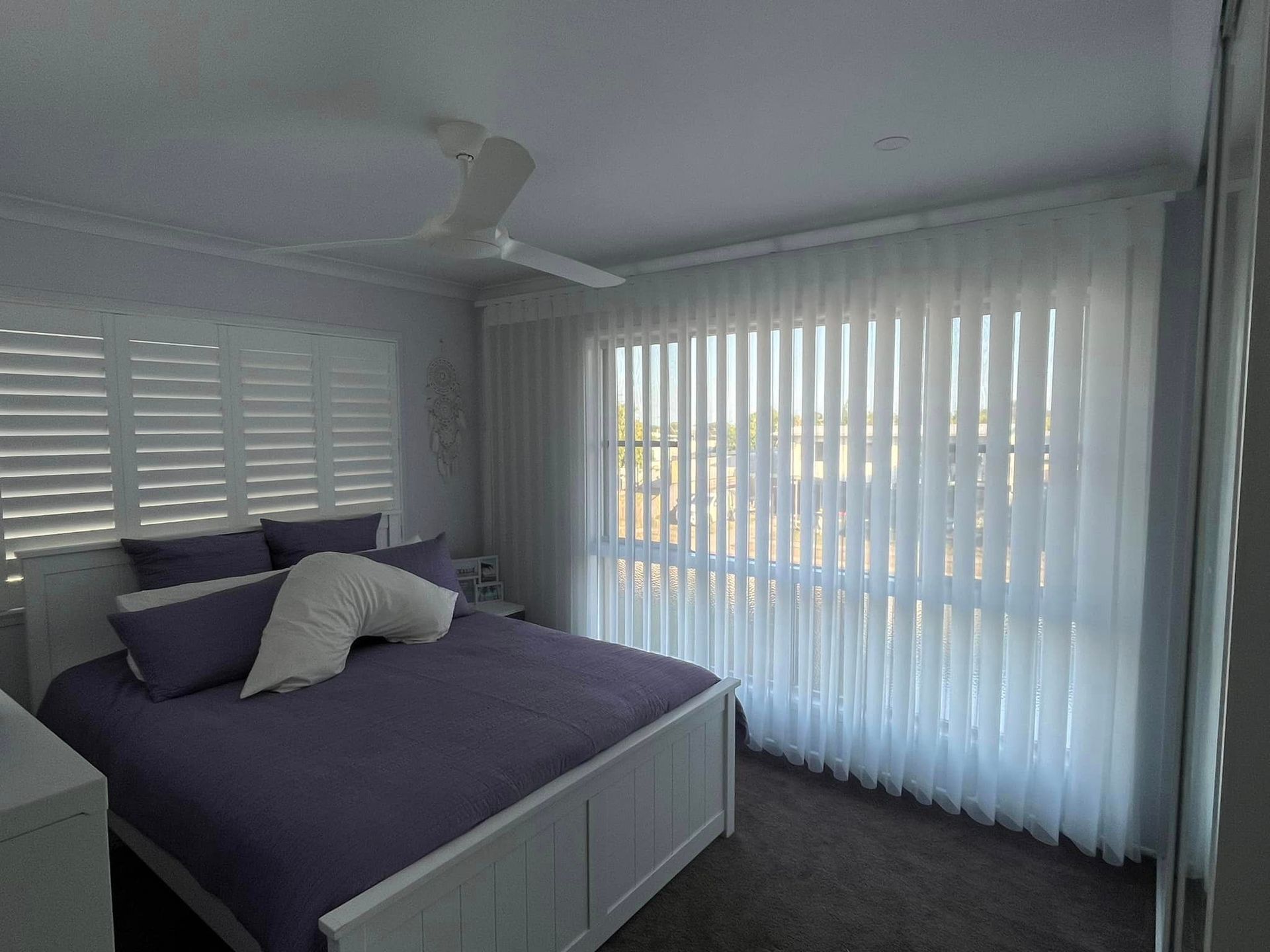 Verticle blinds in a bedroom  — Whitsunday Blinds & Security In Beaconsfield, QLD