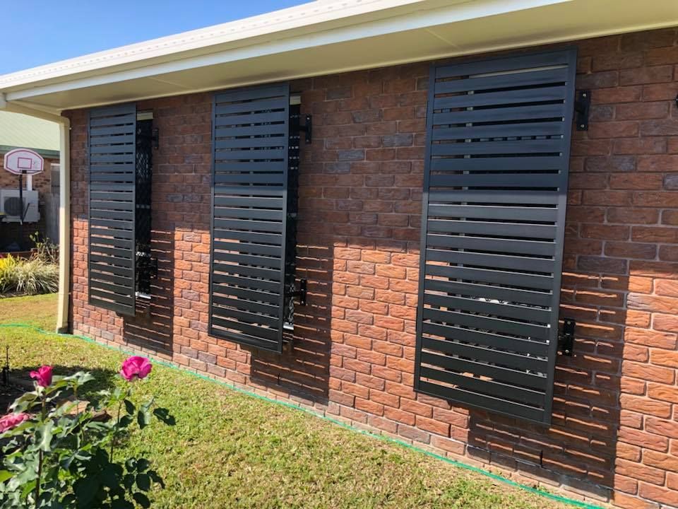 Sun Screens on a Brick Wall  — Whitsunday Blinds & Security In Beaconsfield, QLD