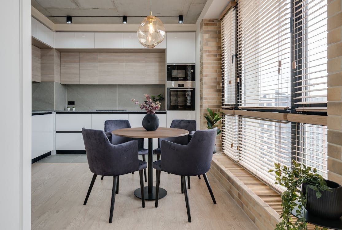 Kitchen with dining table and blinds — Whitsunday Blinds & Security In Beaconsfield, QLD