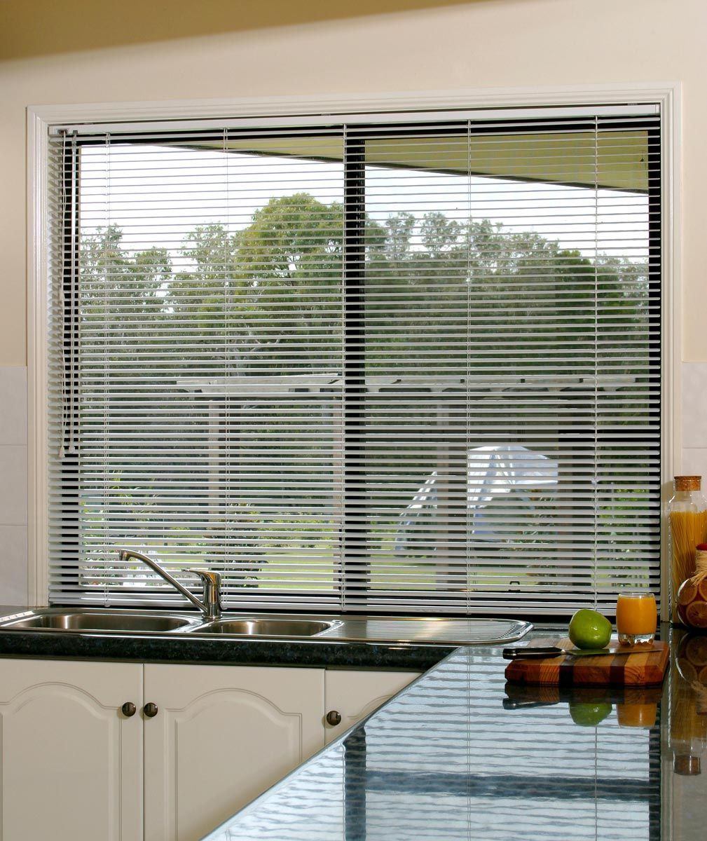 Kitchen With Sink Next to Window With Venetian Window Blinds — Whitsunday Blinds & Security In Beaconsfield, QLD