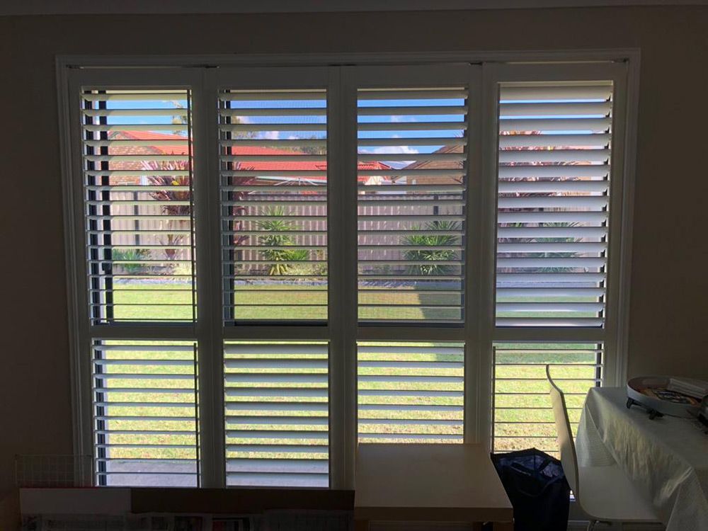 Window Featuring Plantation Shutters — Whitsunday Blinds & Security In Beaconsfield, QLD