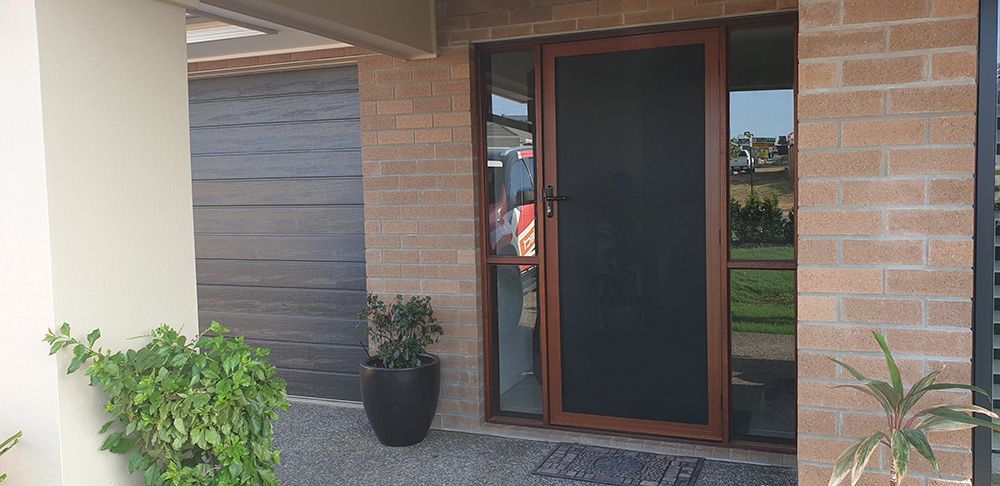 Secure Door With Protective Screen— Whitsunday Blinds & Security In Beaconsfield, QLD