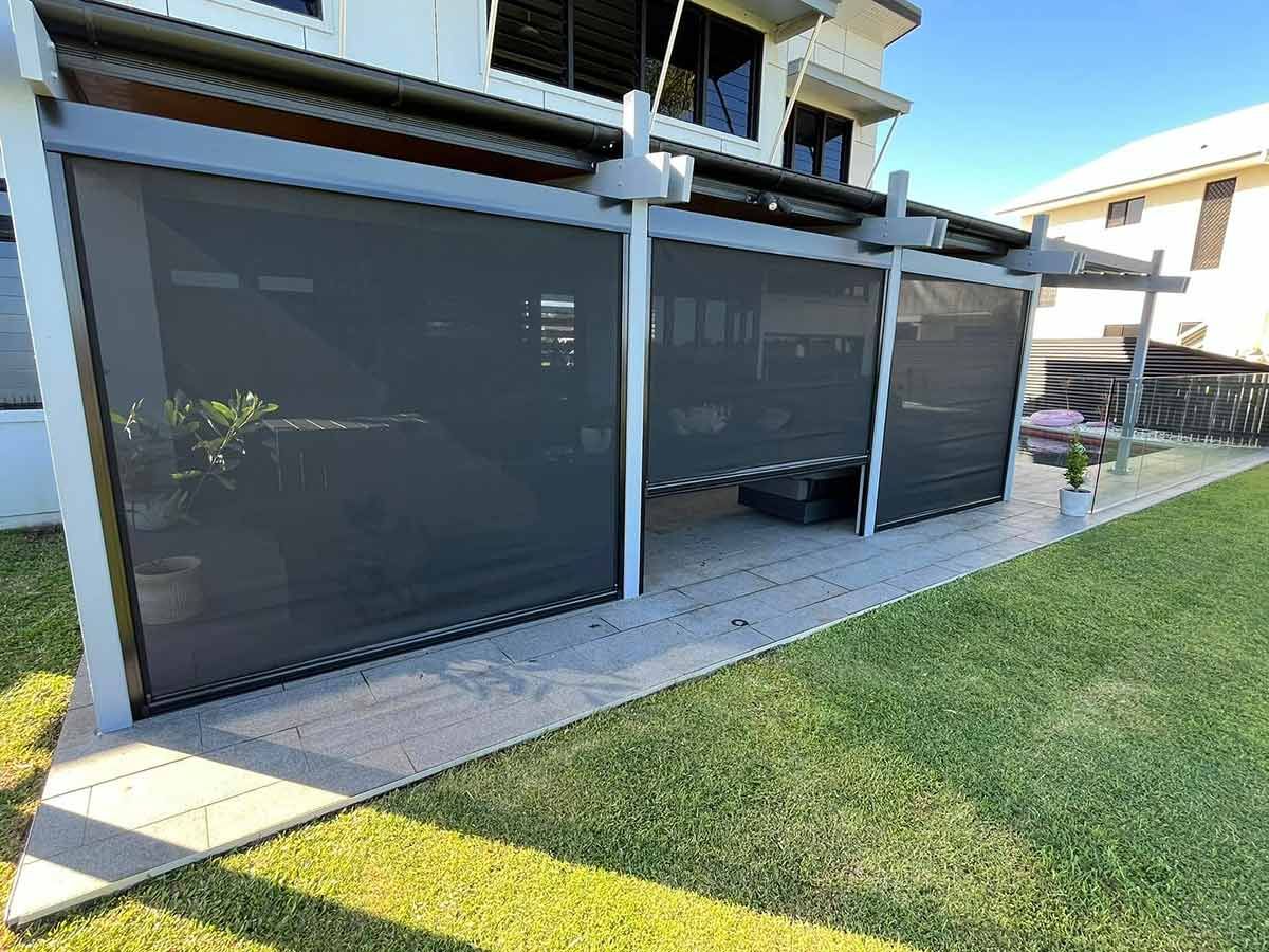 A House With a Patio and a Pergola With Screens on the Side of It — Whitsunday Blinds & Security In Beaconsfield, QLD