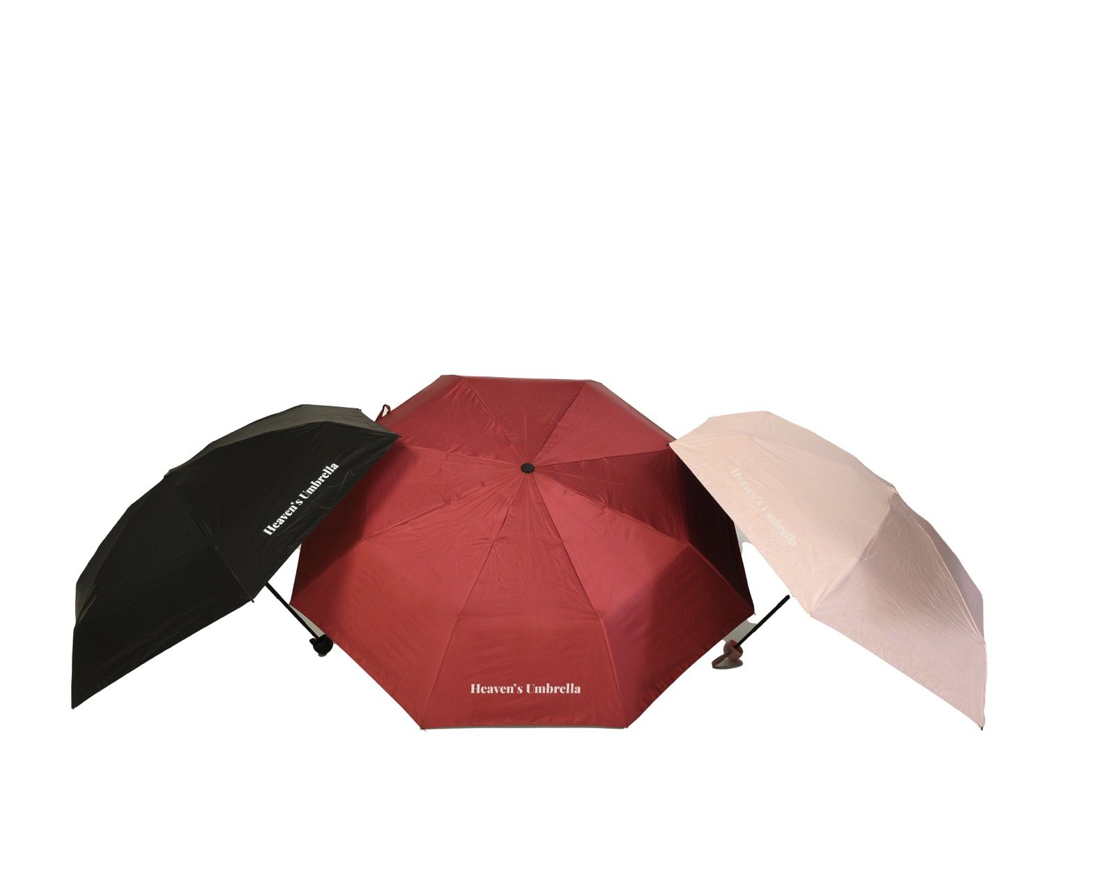 Black folded umbrella with handle and wrist strap on a white background