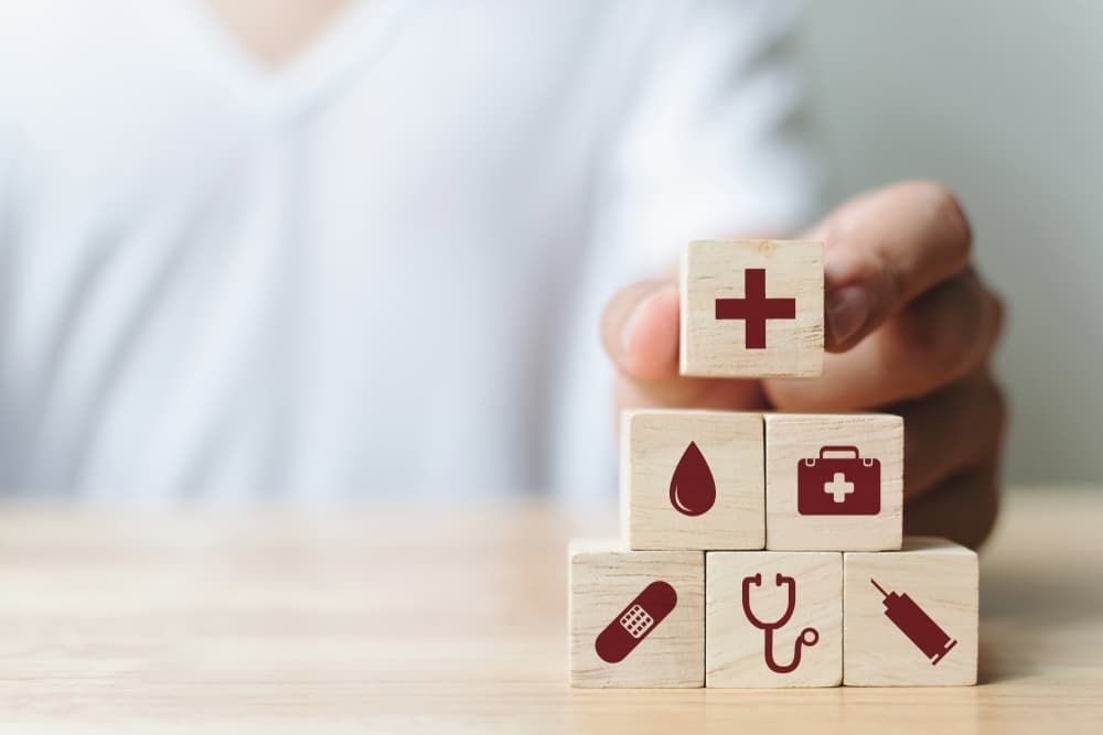 Hand Arranging Wood Block Icon Healthcare - First Aid in Mackay, QLD