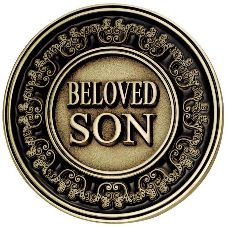 A coin that says beloved son on it