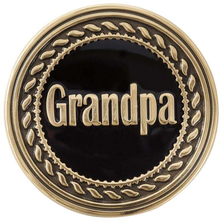 A gold coin with the word grandpa on it
