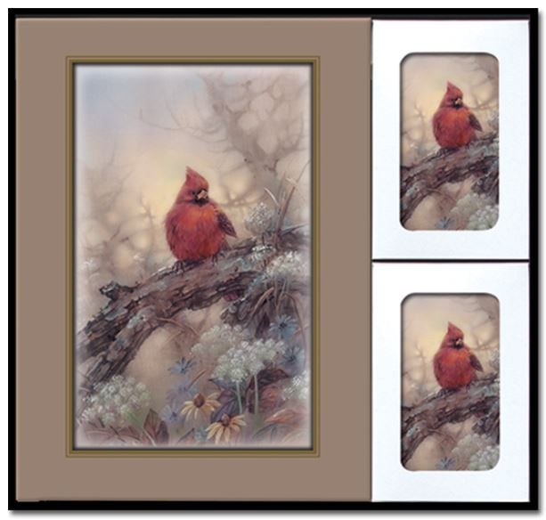 A framed picture of two cardinals sitting on a branch