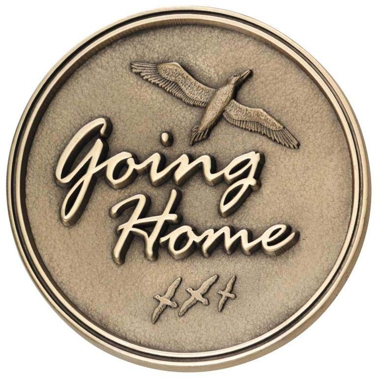A coin that says going home with a bird on it