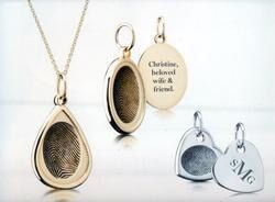 A necklace with a fingerprint inside of it.