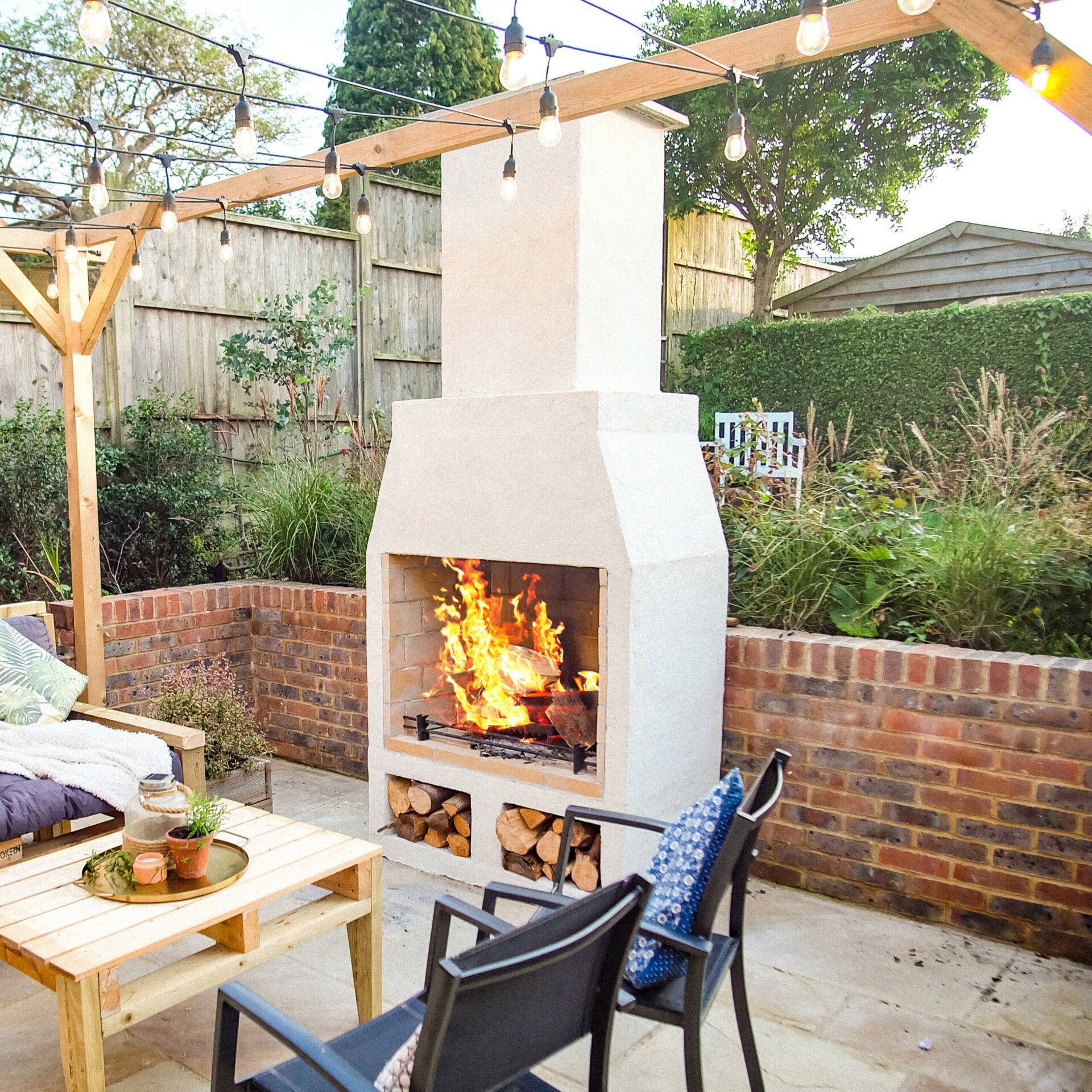 Discover Schiedel Isokern Outdoor Fires at The AGA Shop Stove & Fire Centre Photograph of lit Schiedel Isokern Outdoor Fire