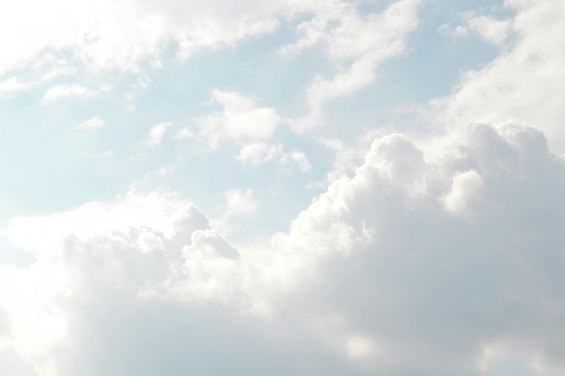 A blue sky with white clouds in it
