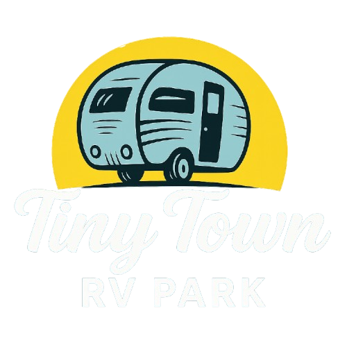 Logo for Tiny Town RV Park: blue camper against yellow sun, text