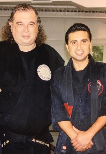 Cerio Ambrosia Martial Arts picture of owner with another martial arts man.