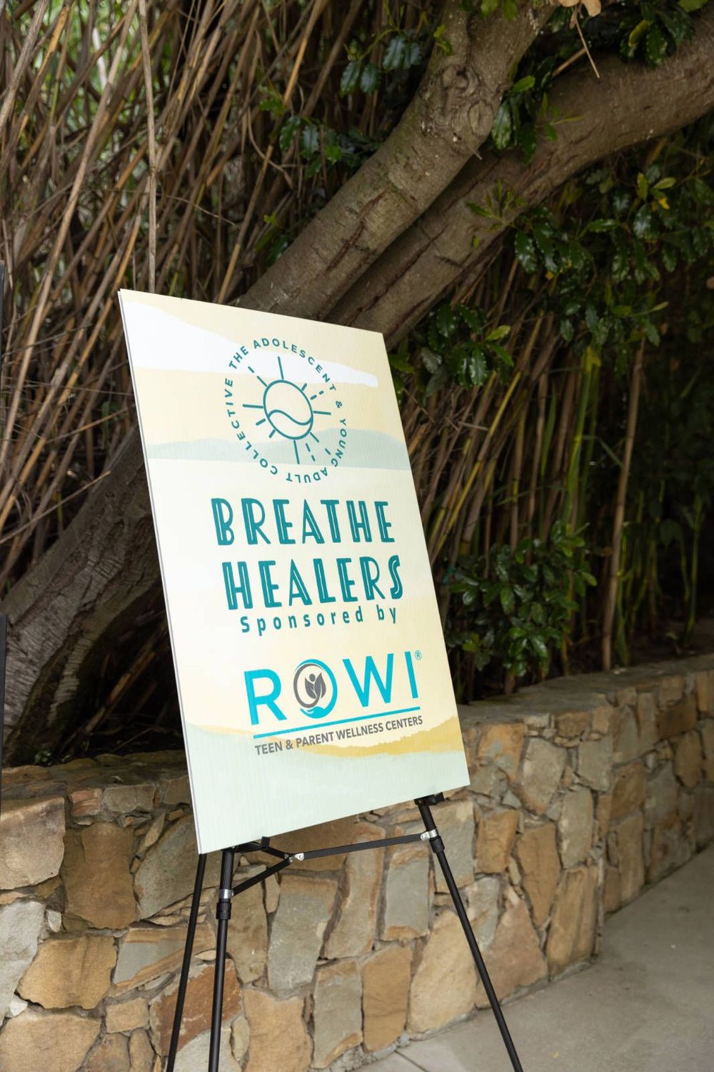 A sign on an easel that says breathe healers