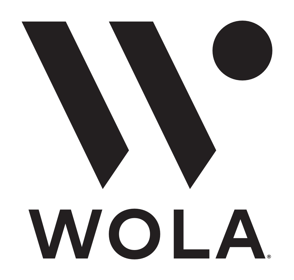 A black and white logo featuring the word "WOLA" in a bold, sans-serif font below a stylized "W" icon with a detached dot.
