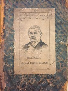 A drawing of a man in a suit and bow tie on a piece of paper.