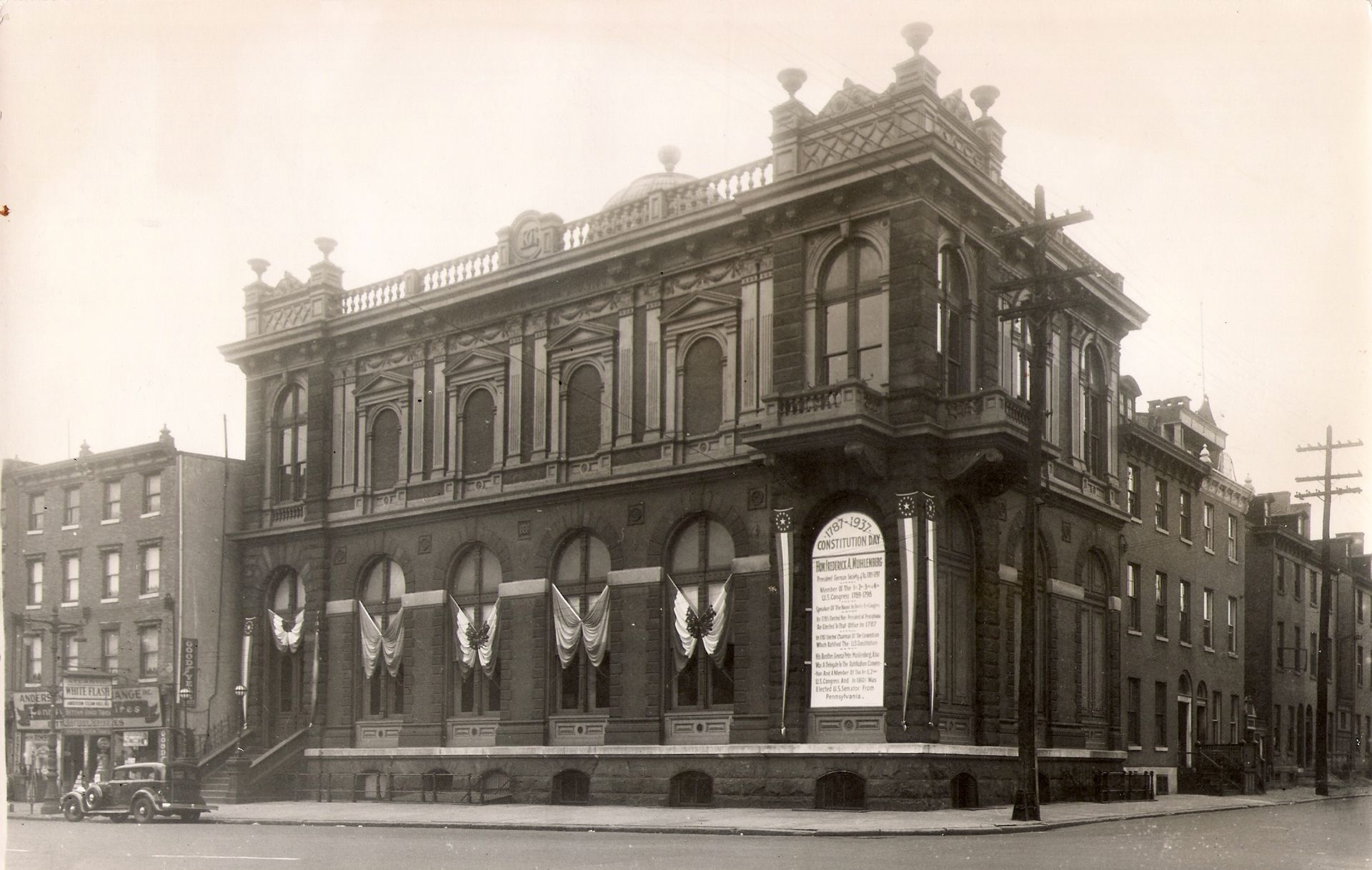 A black and white photo of a large brick building