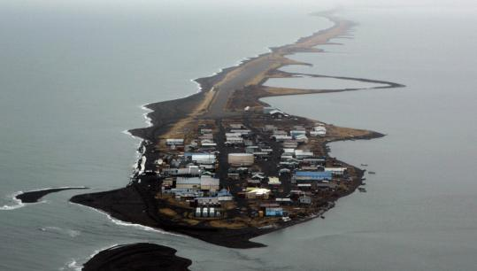 An aerial view of a small island in the middle of the ocean.