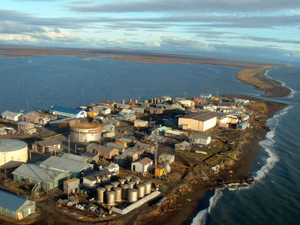 An aerial view of a small town on a small island in the middle of the ocean