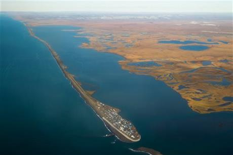 An aerial view of a small island in the middle of the ocean.