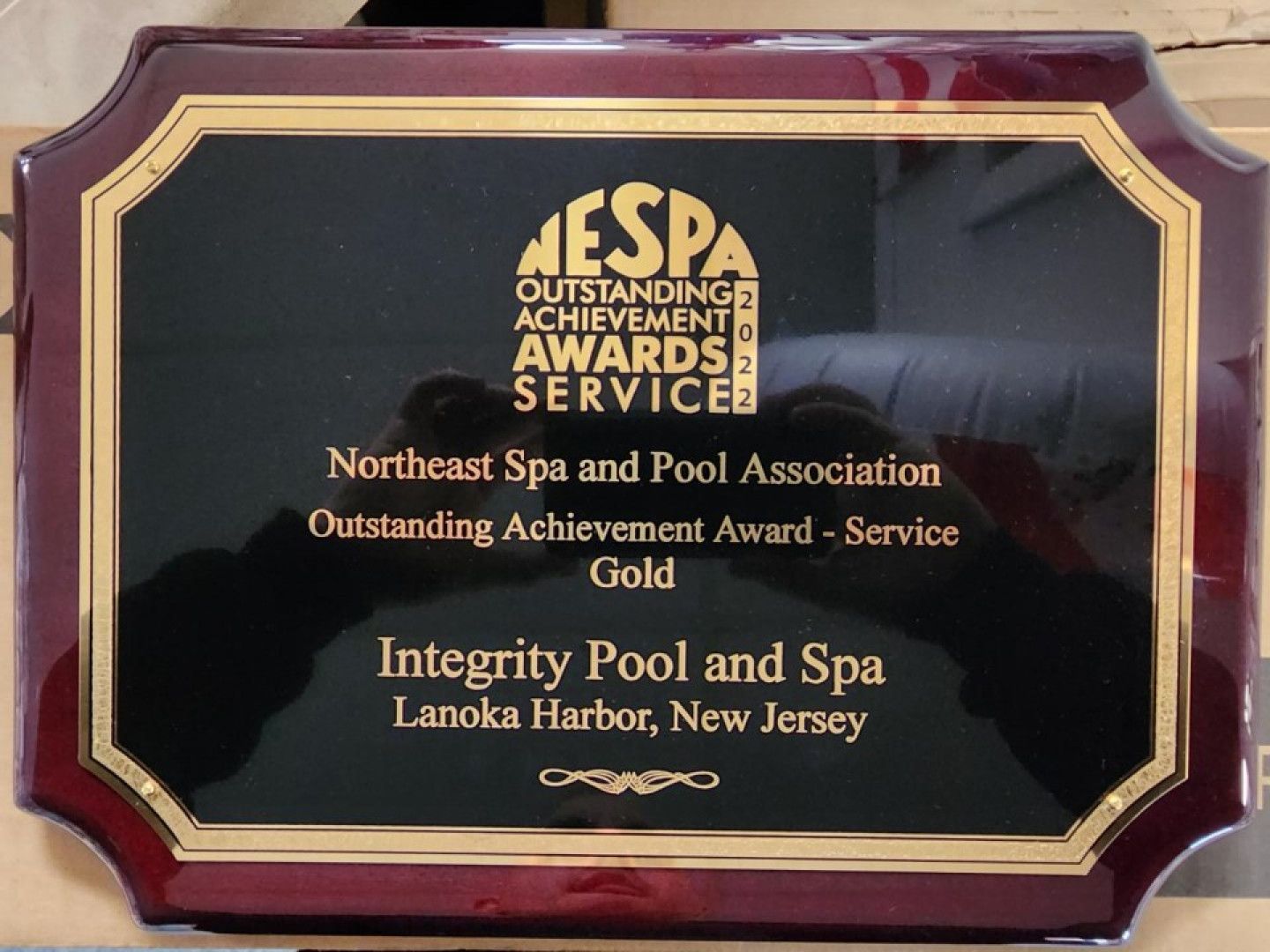 A plaque that says integrity pool and spa on it
