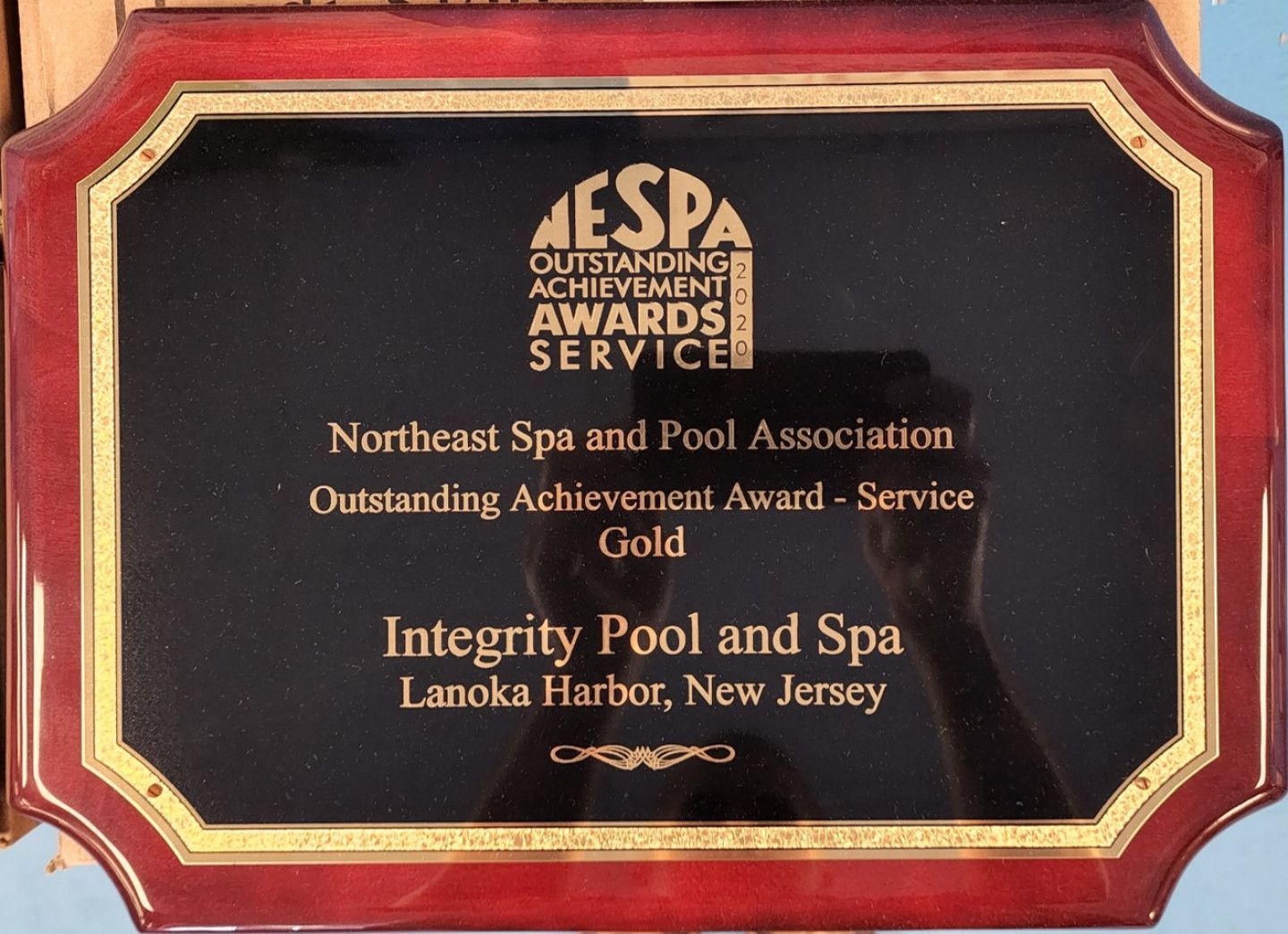 A plaque that says integrity pool and spa on it