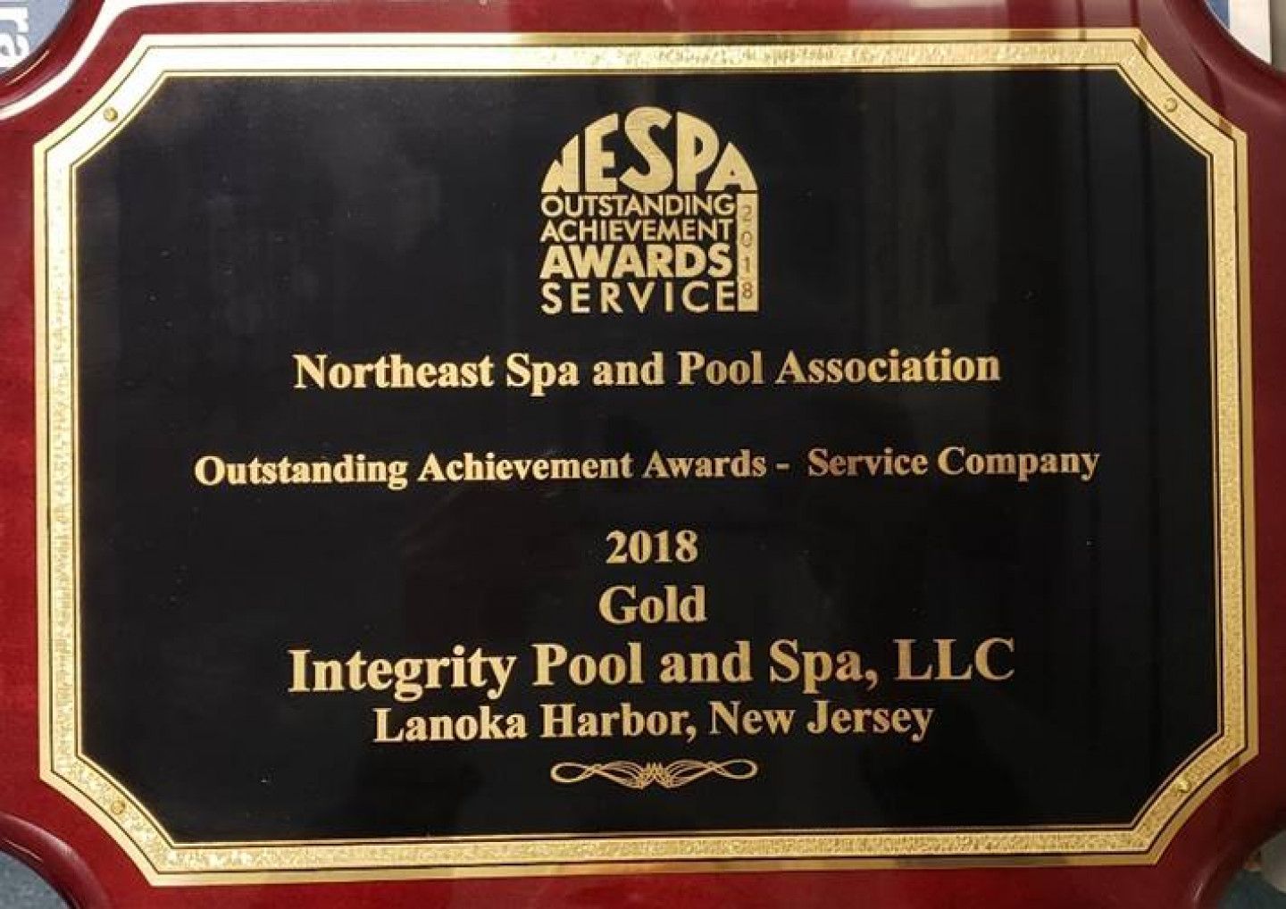 A plaque that says integrity pool and spa llc on it