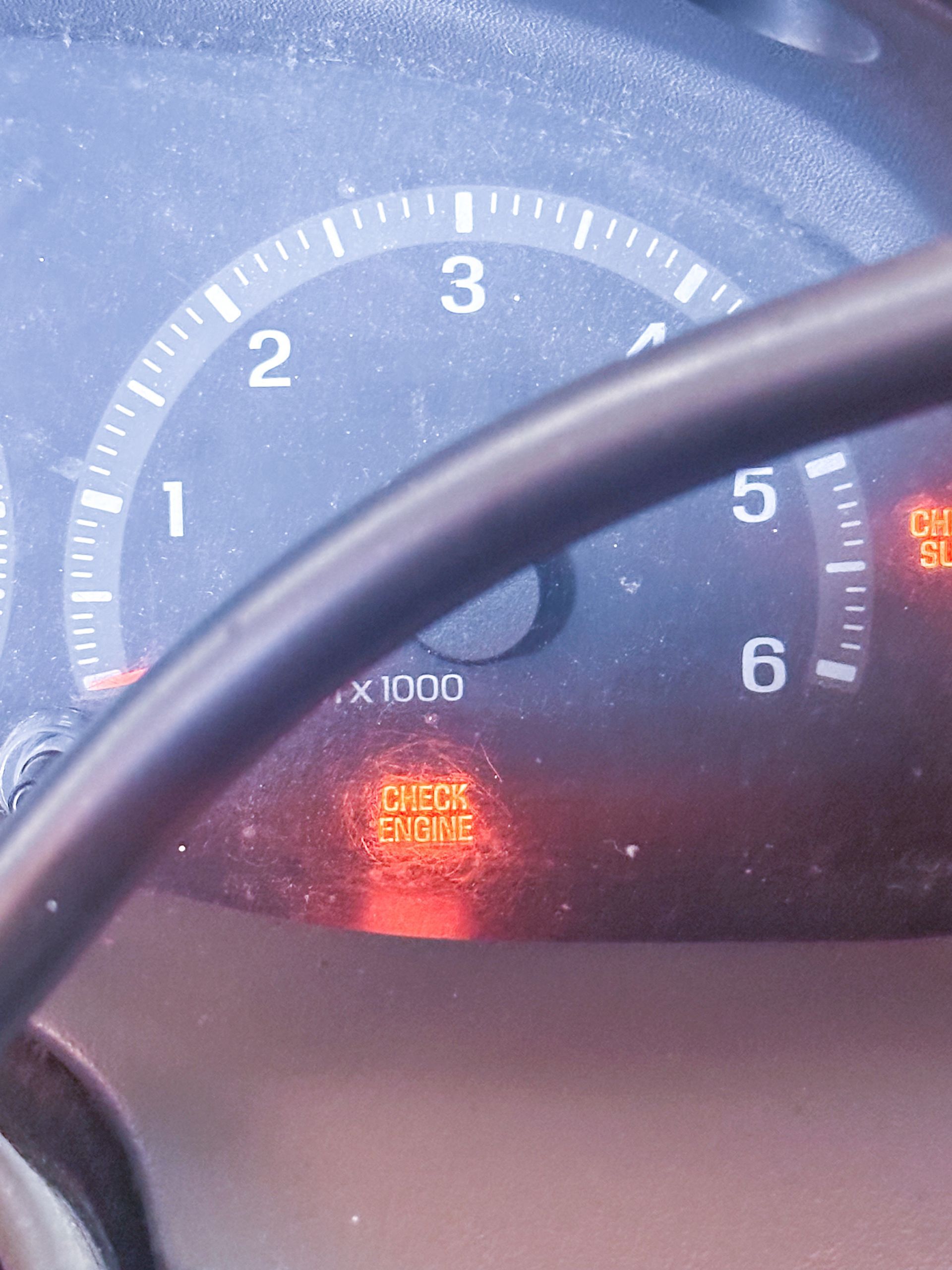 Car dashboard with a lit