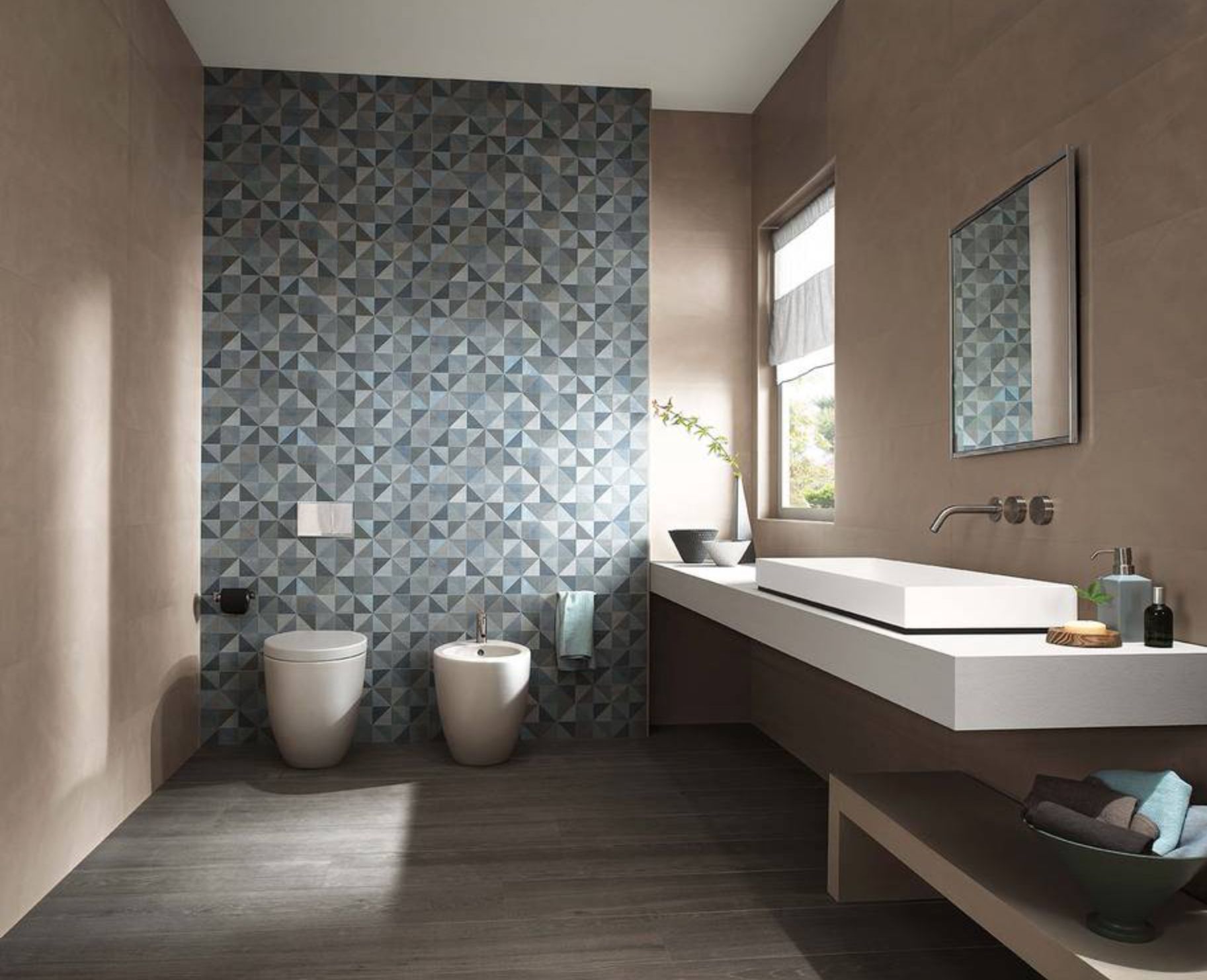 Piastrelle decorative adatte a ogni progetto
Il design d'interni è in costante evoluzione. Al centro di questa rivoluzione, troviamo le piastrelle decorative di Decor Box. Queste piastrelle, ideate specificamente come wall tiles, si prestano a diventare protagoniste della scena domestica per ogni ambiente, da una moderna cucina a un bagno contemporaneo. La diversità e l'unicità delle piastrelle decorative rendono ogni progetto d'interni distintivo e raffinato.
Grafiche contemporanee ed effetti scenici per pareti di grande appeal
Le pareti sono l'anima di ogni spazio e meritano il meglio. Con le piastrelle decorative Decor Box, ogni parete diventa una tela d'arte. La gamma variegata di collezioni spazia da suggestive piastrelle scenografiche a innovative soluzioni 3D wall, dall’effetto tridimensionale.