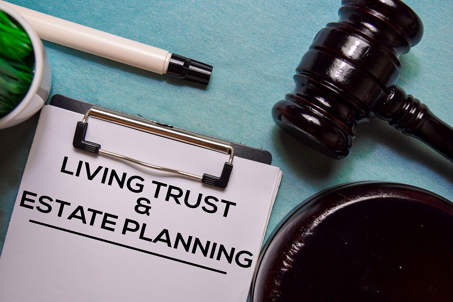 Living Trust & Estate Planning document with gavel on office desk. Living Trust & Estate Planning document with gavel on office desk.
