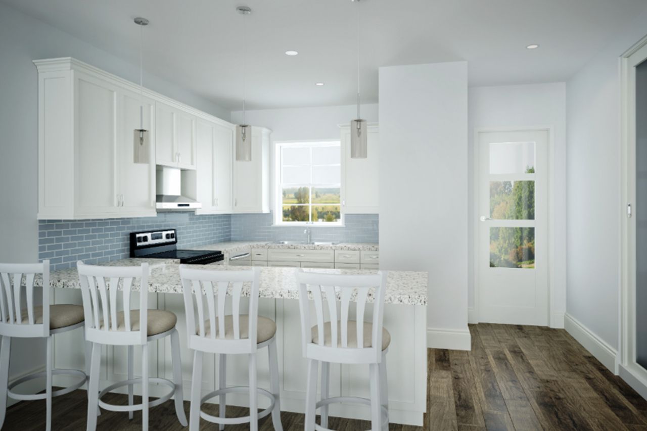 A kitchen with white cabinets and stools and a large island. A kitchen with white cabinets and stools and a large island.