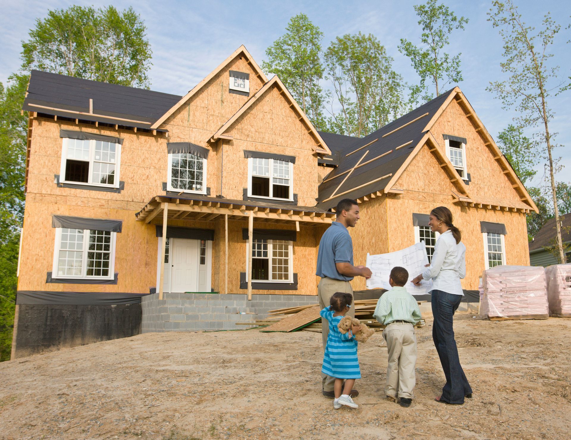 Family viewing their new home construction.