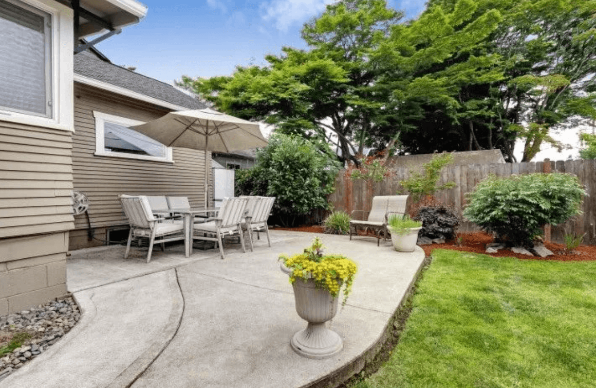 Concrete contractor pours a new patio for a backyard in chicago