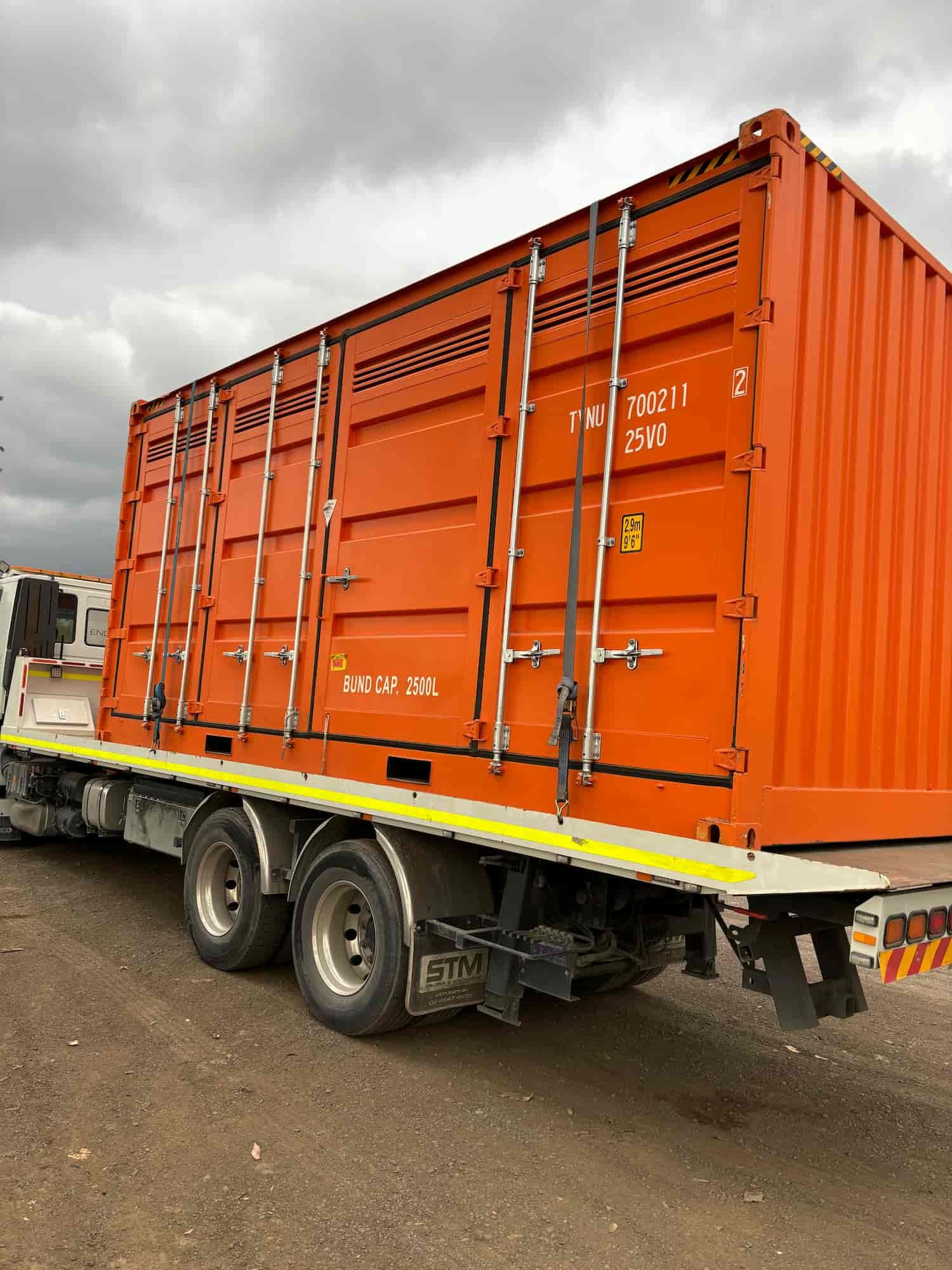 A Large Orange Shipping Container Is On The Back Of A Truck — TSR Total Shipping Containers In Port Macquarie, NSW