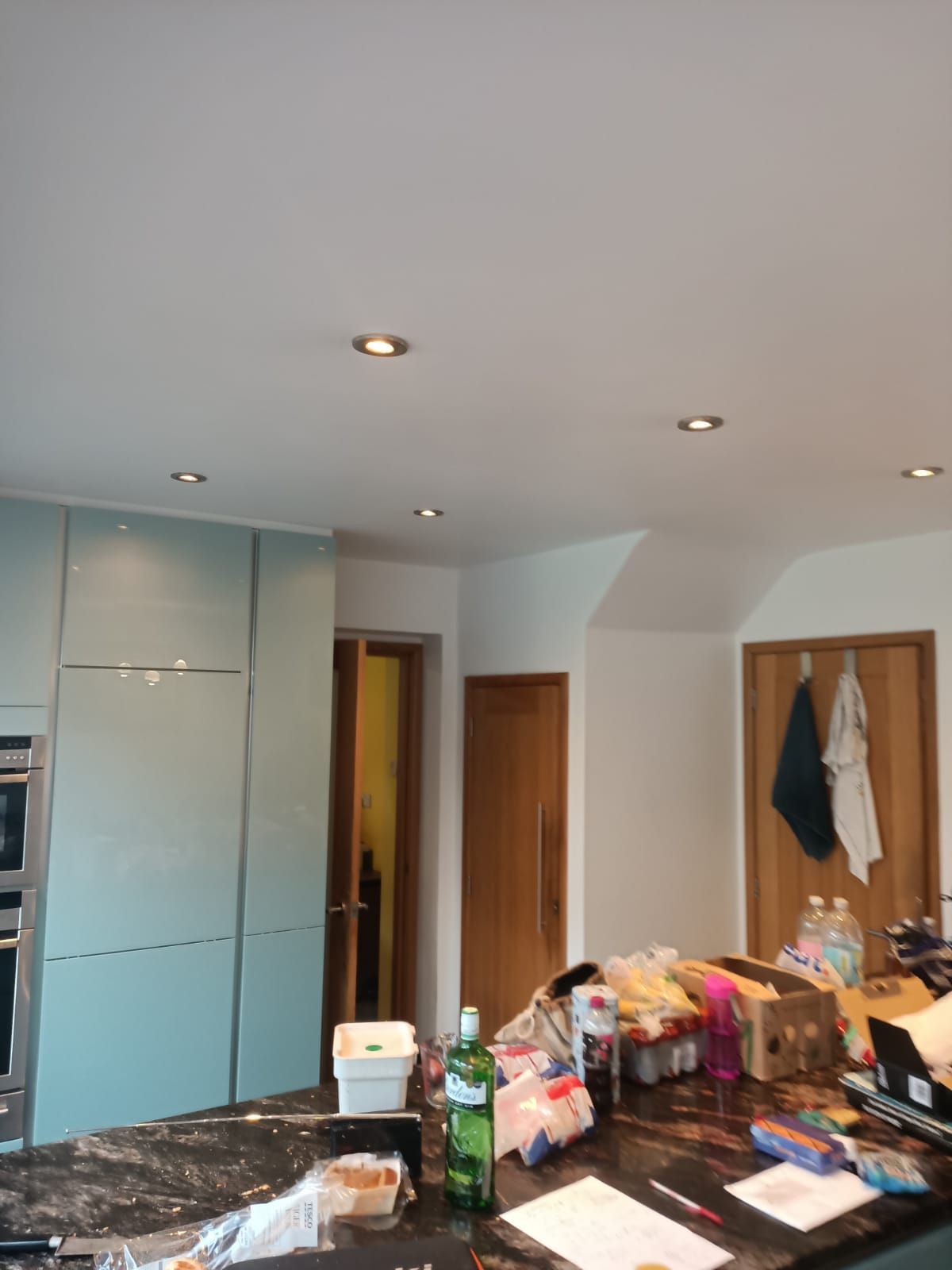 A kitchen with a bottle of soap on the counter
