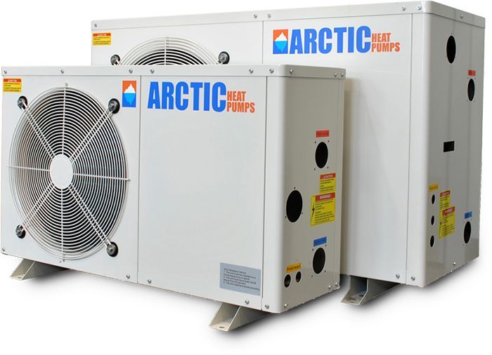 Two white Arctic heat pumps, outdoors.