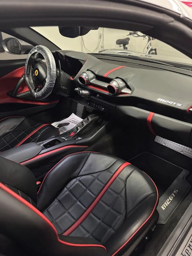 Same Ferrari interior after detailing with clean leather seats, Ongowash mobile detailing serving Stafford, TX