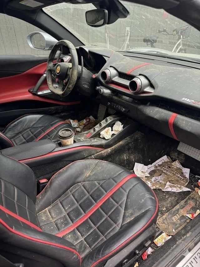Ferrari interior with dirty seats and trash before detailing, Ongowash mobile detailing serving Missouri City, TX